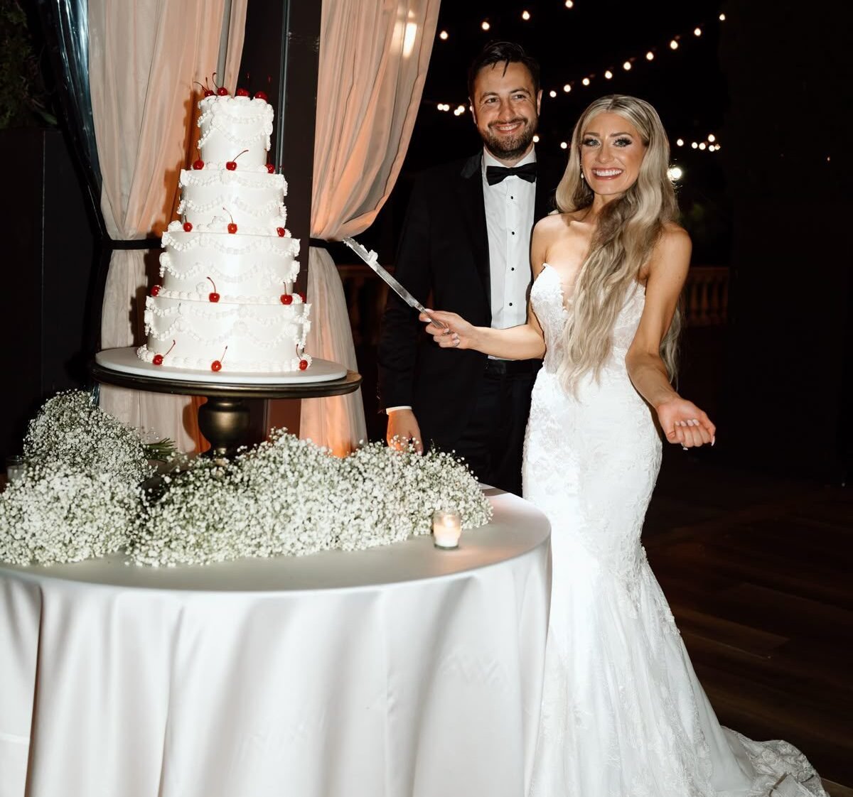 Wedding cake cutting at wedding yacht rental Dubai celebration.