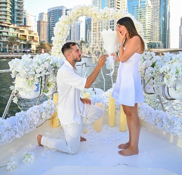 Engagement party yacht Dubai with couple on a decorated private yacht.